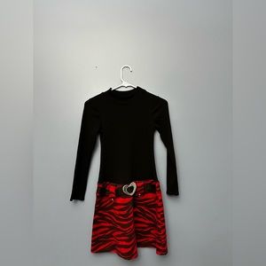 Black dress with a red zebra print skirt